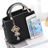 Black Embroidered Handbag: Stylish, Geometric, Tassel Detail, Zip Closure - Shop N Save